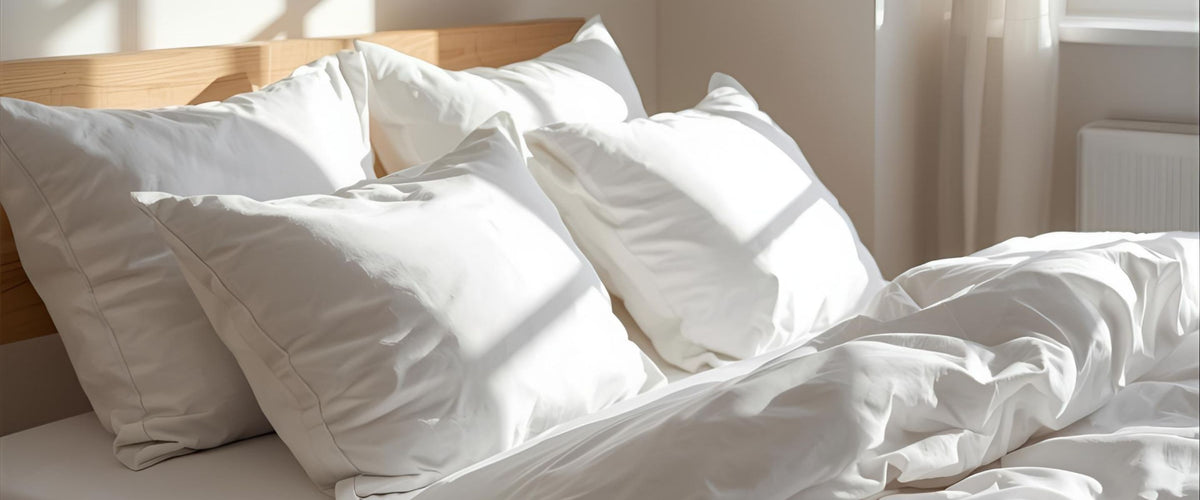 Luxuriously soft organic cotton bed sheets by Trees and Hugs, styled in natural light for a cozy and sustainable sleep experience