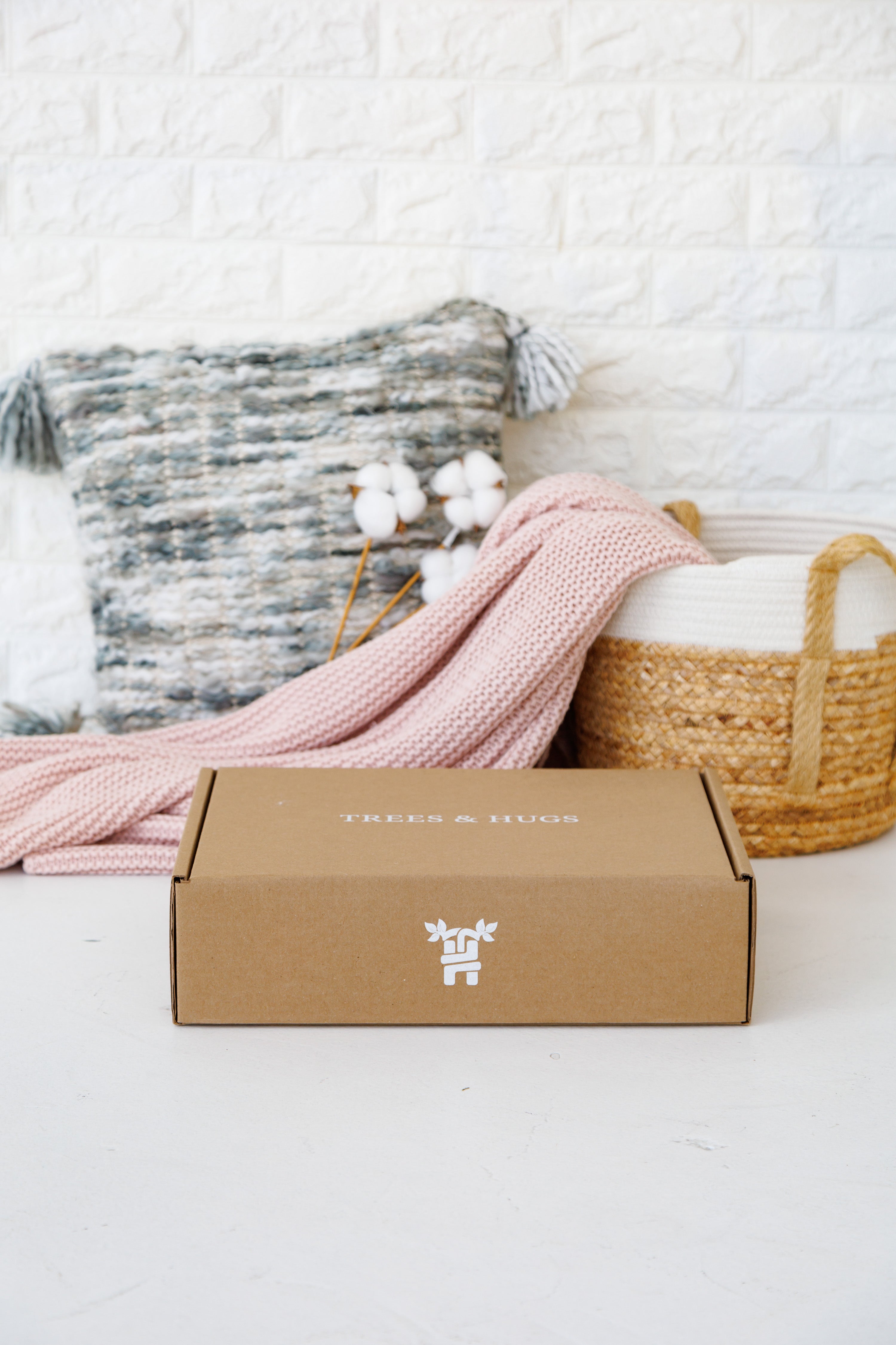 Brown packaging box decorated with basket and pillow